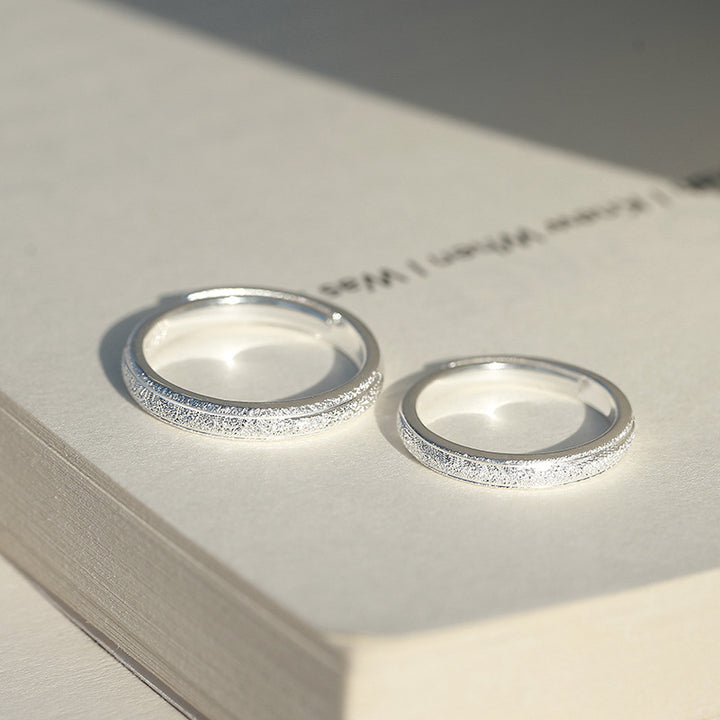 A Pair Of Silver Rings Are Simple